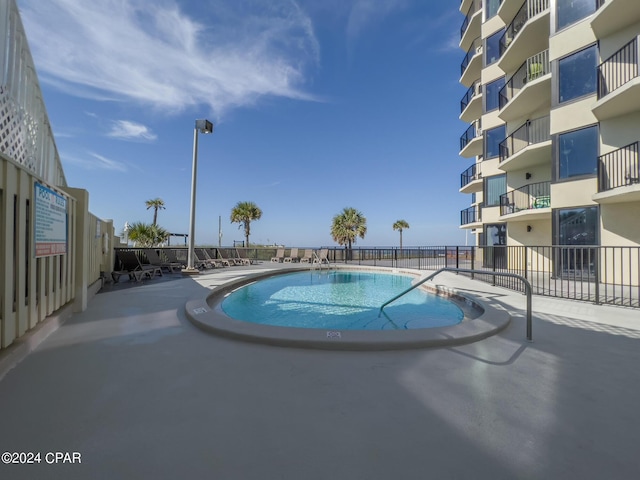 view of swimming pool with a patio