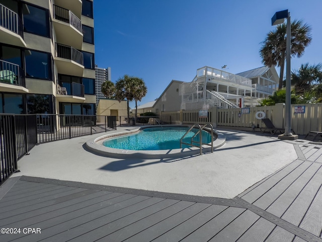 view of swimming pool featuring a patio area