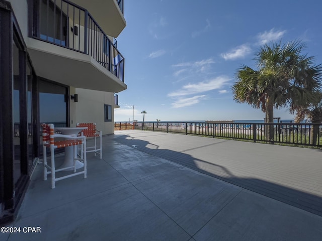 view of patio featuring a water view