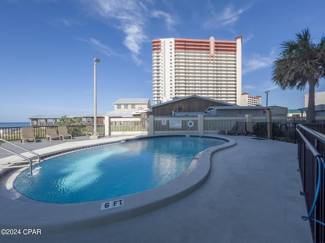 view of pool featuring a patio area