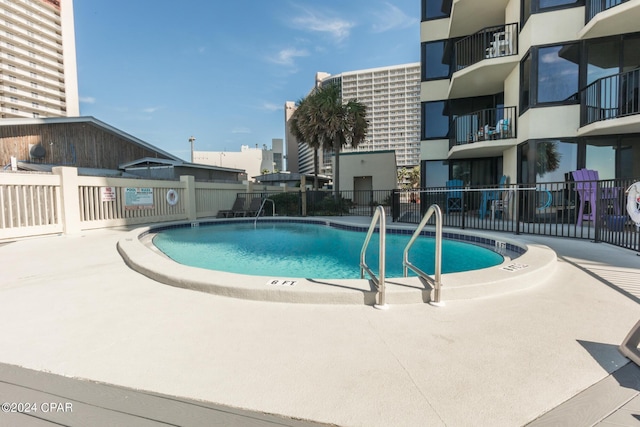 view of swimming pool featuring a patio