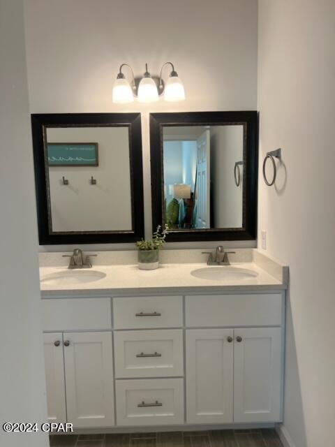 bathroom with double vanity and a sink