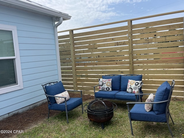 view of patio / terrace featuring an outdoor living space with a fire pit