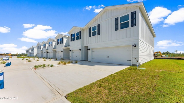 view of front of home featuring a front yard and a garage