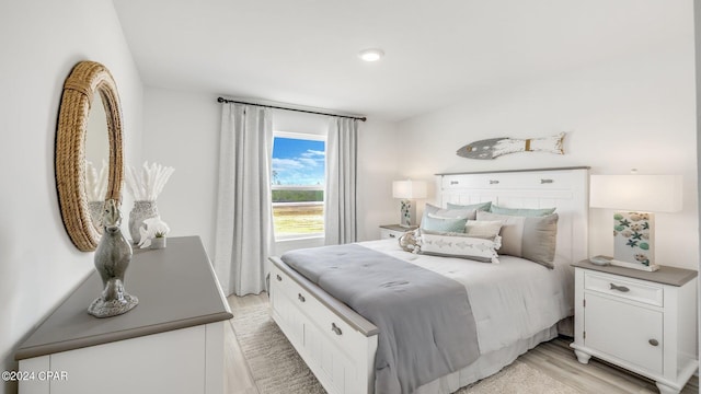 bedroom with light wood finished floors