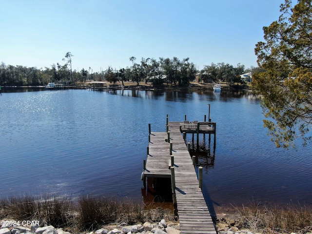 view of dock with a water view