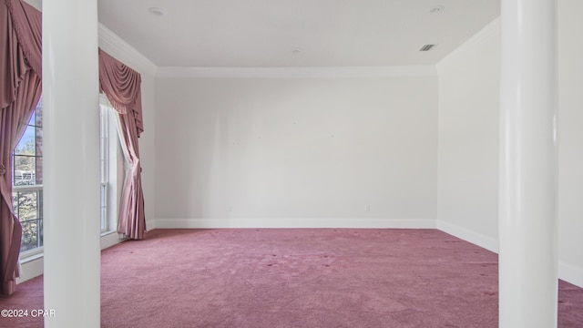 carpeted spare room with baseboards, visible vents, and ornamental molding