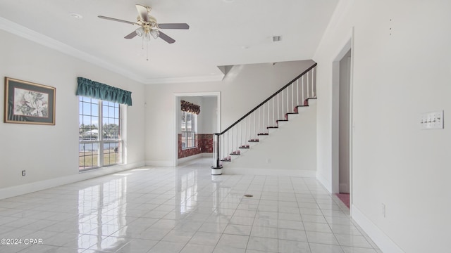 foyer featuring stairs, ornamental molding, and baseboards