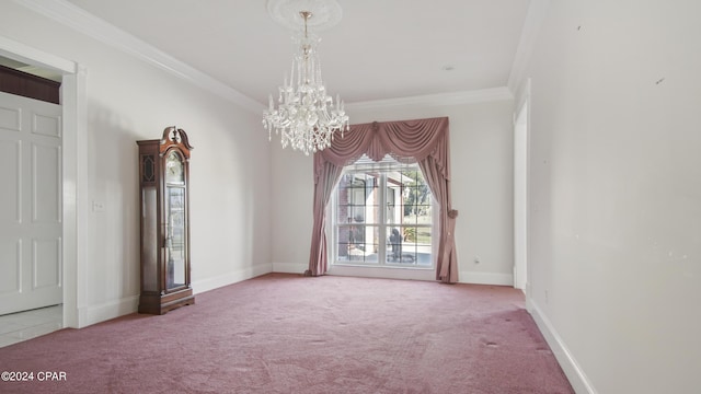 unfurnished dining area featuring carpet, crown molding, baseboards, and an inviting chandelier