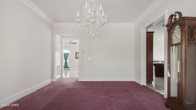 interior space featuring crown molding, baseboards, and ceiling fan with notable chandelier