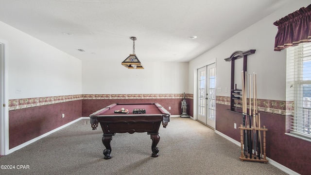 playroom featuring a wealth of natural light, french doors, wainscoting, and carpet flooring