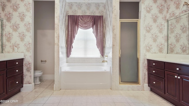 bathroom with wallpapered walls, a stall shower, and vanity