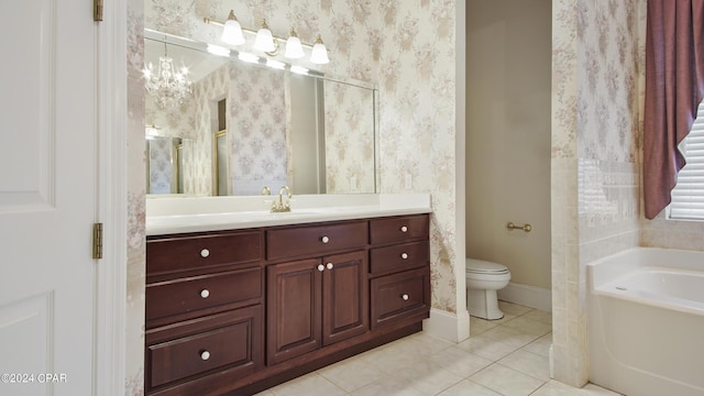 bathroom with a garden tub, wallpapered walls, toilet, vanity, and tile patterned floors