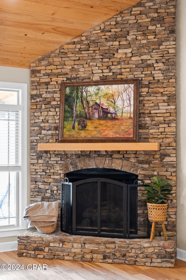 details featuring a fireplace and light hardwood / wood-style floors