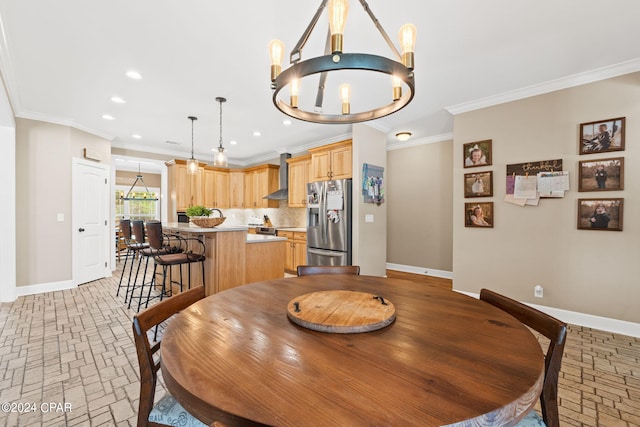 dining area featuring crown molding