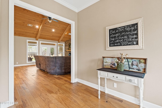 corridor featuring lofted ceiling with beams, light hardwood / wood-style floors, and wooden ceiling