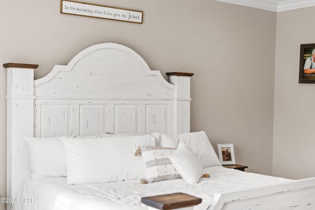 bedroom featuring crown molding