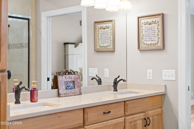 bathroom with vanity with extensive cabinet space and double sink