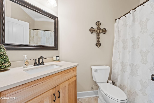 bathroom with crown molding, toilet, tile flooring, and vanity