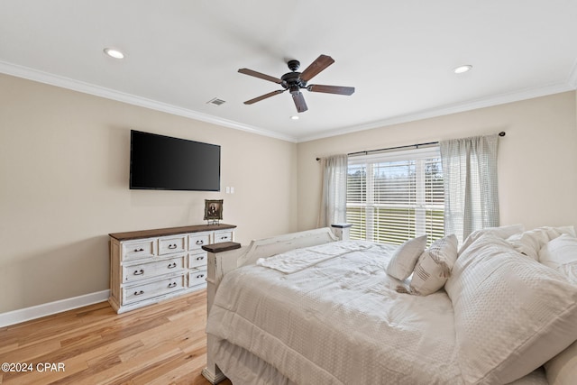 bedroom with crown molding, light hardwood / wood-style flooring, and ceiling fan