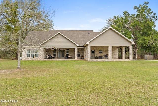 craftsman house featuring a front yard and a patio area