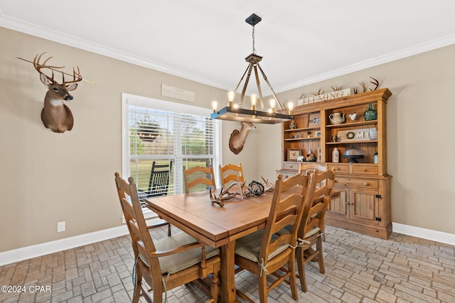 dining area featuring a chandelier and ornamental molding