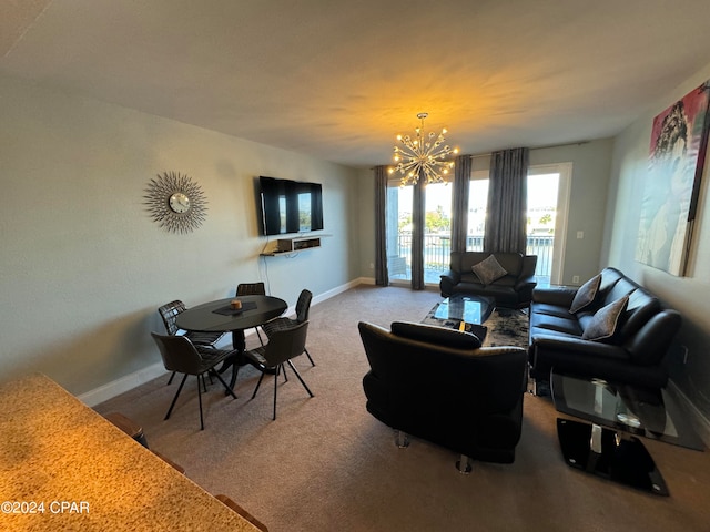 living room featuring carpet floors and a chandelier