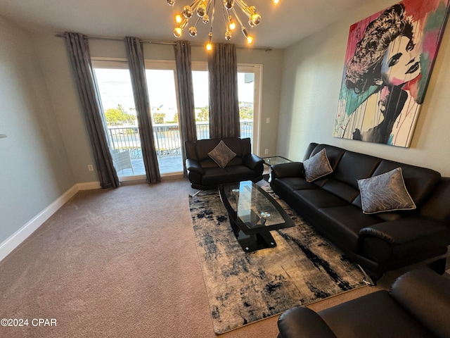 living room featuring a chandelier and carpet