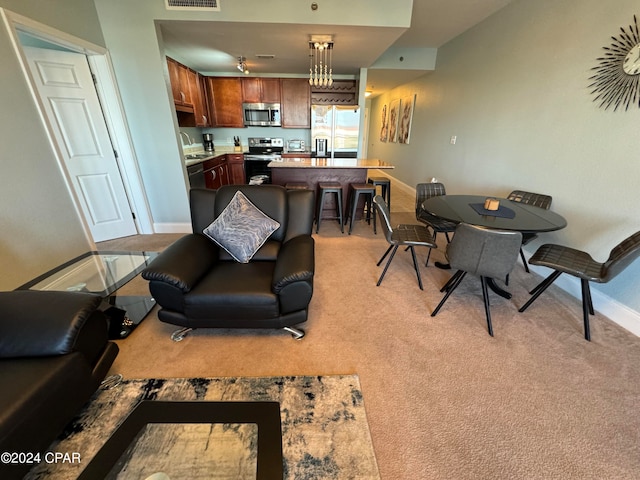 carpeted living room with sink