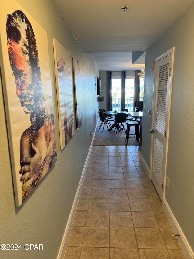 hall featuring tile patterned flooring