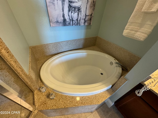 bathroom featuring a tub to relax in and tile patterned floors