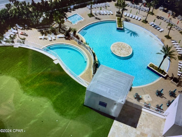 view of pool featuring a patio