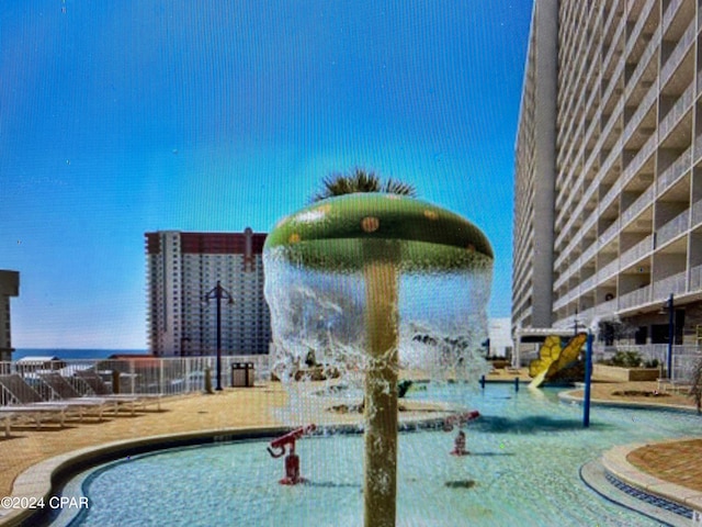 view of pool with pool water feature