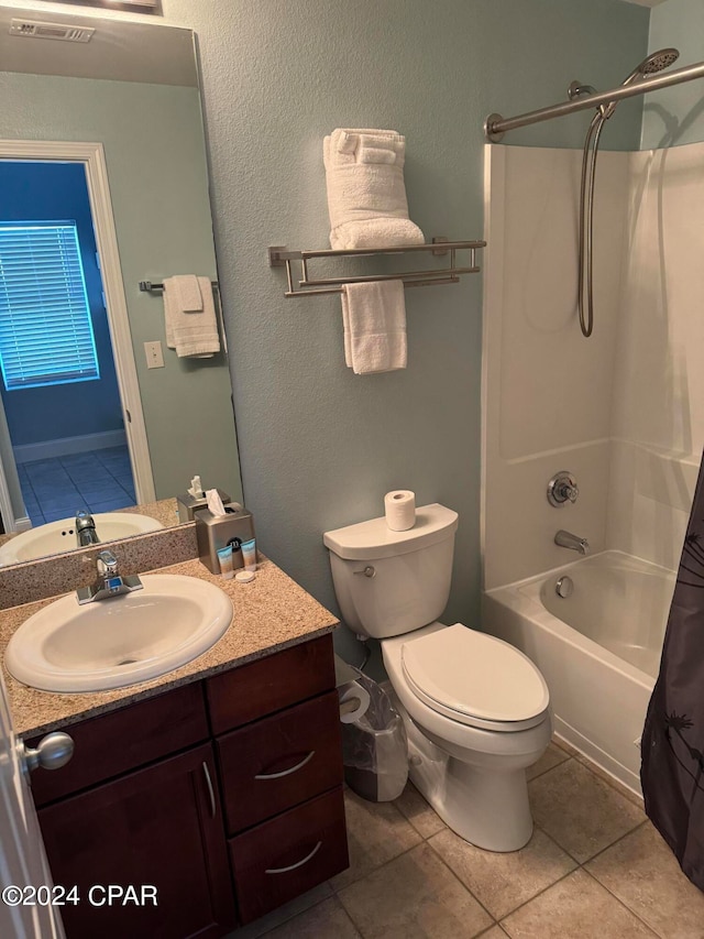 full bathroom featuring vanity, toilet, shower / bathtub combination with curtain, and tile patterned floors