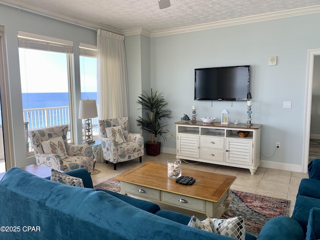 tiled living room featuring a water view, crown molding, and a textured ceiling