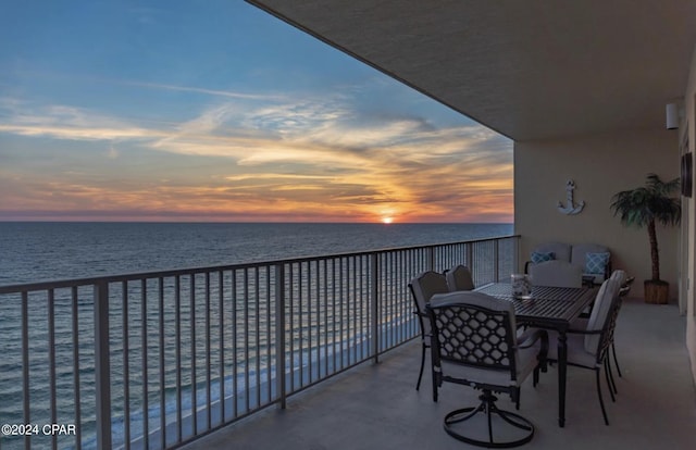 balcony at dusk with a water view