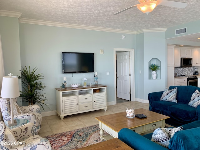 living room featuring ceiling fan, ornamental molding, a textured ceiling, and light tile patterned flooring