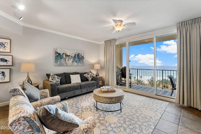 living room with a water view, light tile floors, ornamental molding, and ceiling fan