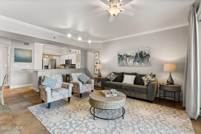 living room with crown molding, ceiling fan, rail lighting, and light tile floors