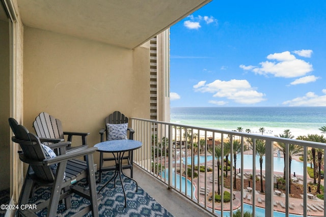 balcony featuring a water view