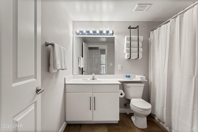 bathroom with oversized vanity, tile flooring, and toilet