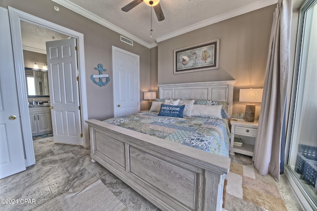 tiled bedroom featuring ensuite bath, ceiling fan, a textured ceiling, sink, and ornamental molding