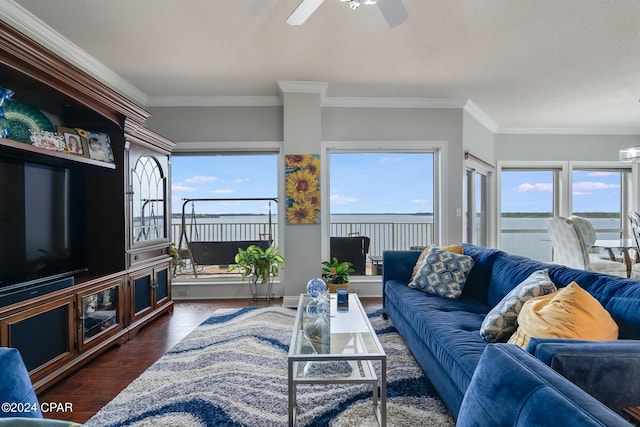 living room featuring dark hardwood / wood-style flooring, a water view, ceiling fan, and crown molding