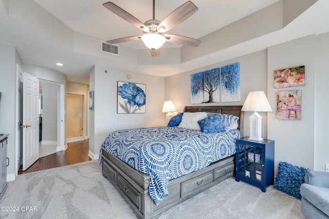 bedroom featuring ceiling fan and light hardwood / wood-style flooring