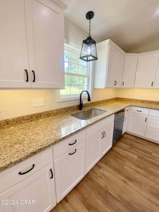 kitchen featuring white cabinetry, a sink, and stainless steel dishwasher