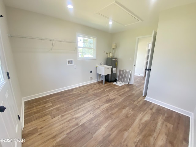 laundry area with hookup for an electric dryer, laundry area, washer hookup, wood finished floors, and visible vents