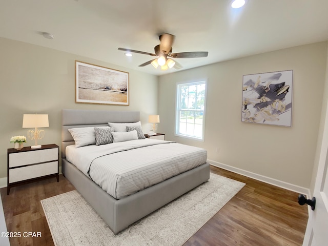 bedroom featuring dark wood-style floors, recessed lighting, a ceiling fan, and baseboards