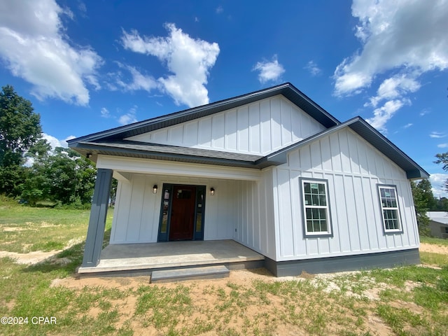 view of front of house with covered porch and board and batten siding