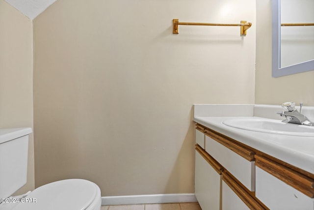 bathroom with vanity, toilet, and tile patterned floors