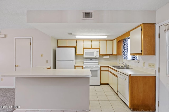 kitchen featuring sink, light tile patterned flooring, a textured ceiling, and white appliances